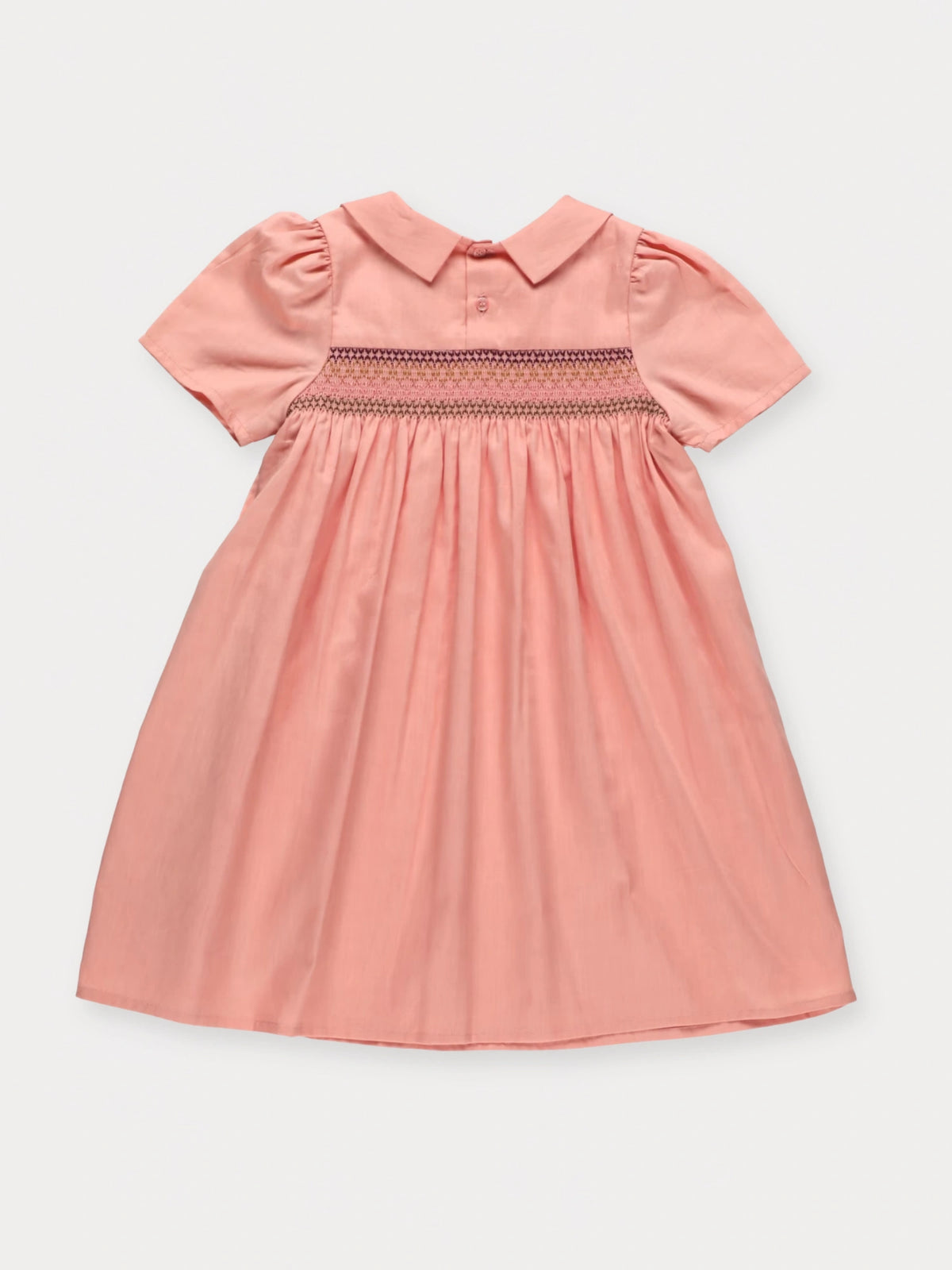Early Sunday, Erika Dress in Blush Pink, made from Cotton Satin fabric, featuring a floral embroidery on a Peter Pan collar with a delicately smocked chest, shown in a back flat-lay view