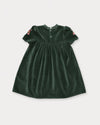 Early Sunday, Erika Dress in Forest Green, made from Cotton Velvet Velour's fabric, featuring a beautiful embroidery with frilled neckline, shown in a back flat-lay view