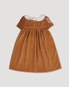 Early Sunday, Erika Dress in Almond, made from Dyed Cotton Velvet fabric, featuring Flowy A-line silhouette allows ease of movement and day-long comfort, shown in a back flat-lay view