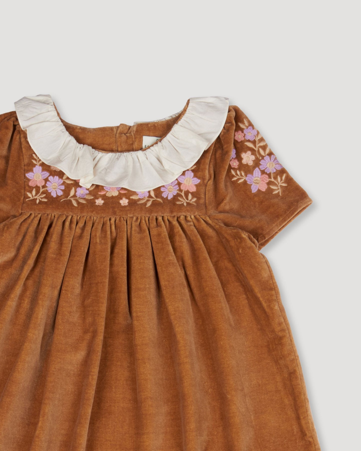 Early Sunday, Erika Dress in Almond, made from Dyed Cotton Velvet fabric, featuring Flowy A-line silhouette allows ease of movement and day-long comfort, shown in a closeup flat-lay view