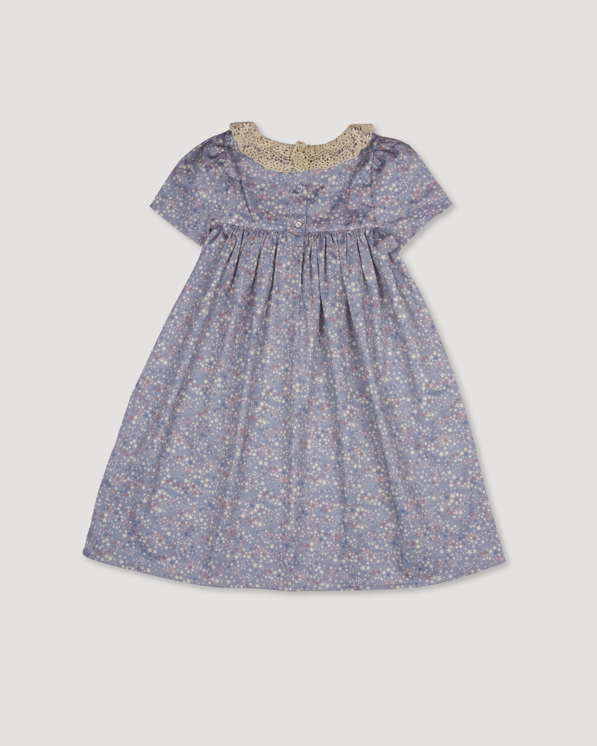 Early Sunday, Erika Dress in Celestial print, made from Printed Cotton Satin fabric, featuring Flowy A-line silhouette allows ease of movement and day-long comfort, shown in a back flat-lay view