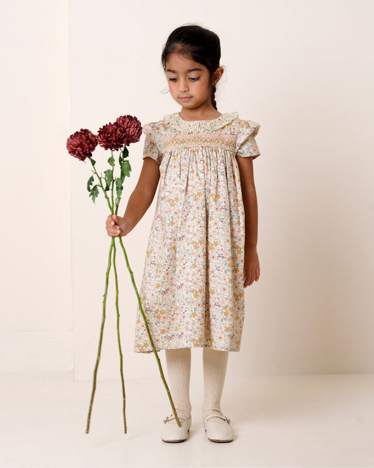 Early Sunday, Erika Dress in Floral print, made from Printed Cotton Satin fabric, featuring Flowy A-line silhouette allows ease of movement and day-long comfort, shown in a front view of model wearing it