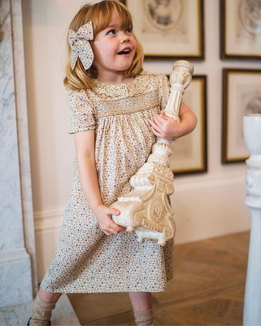 Early Sunday, Erika Dress in Miny Flowers print, made from Printed Cotton Satin fabric, featuring Flowy A-line silhouette allows ease of movement and day-long comfort, shown in a front view of model wearing it