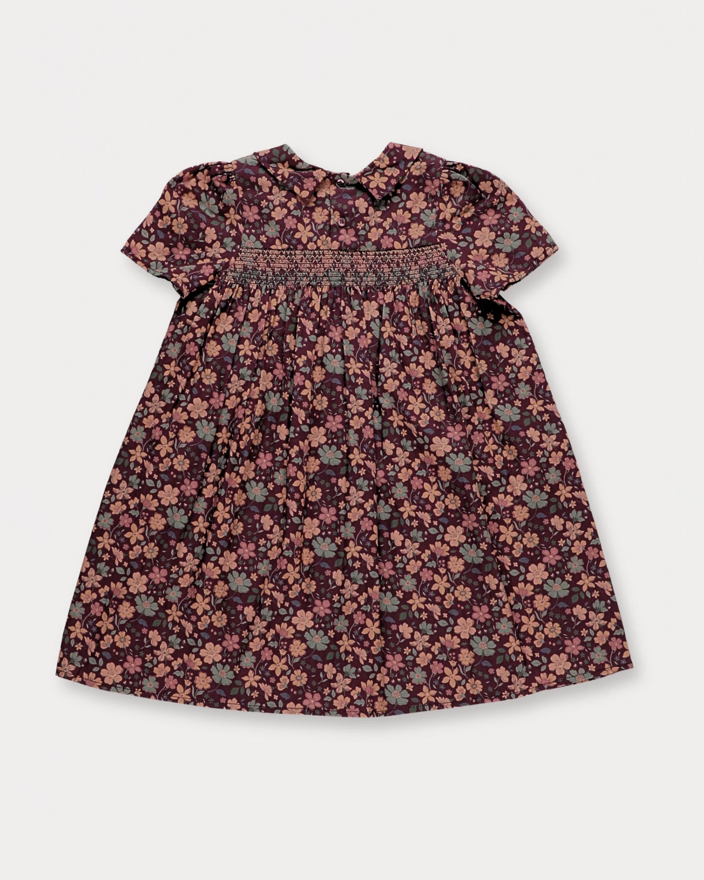 Early Sunday, Erika Dress in Plum, made from Printed Cotton Satin fabric, featuring a floral print with peter pan collar, shown in a back flat-lay view