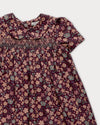 Early Sunday, Erika Dress in Plum, made from Printed Cotton Satin fabric, featuring a floral print with peter pan collar, shown in a closeup flat-lay view