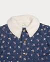 Early Sunday, Esmée Jacket in Ditsy Bouquet Navy, made from Printed Cotton Satin fabric, featuring a quilted layer with floral detailing, shown in a closeup flat-lay view