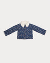 Early Sunday, Esmée Jacket in Ditsy Bouquet Navy, made from Printed Cotton Satin fabric, featuring a quilted layer with floral detailing, shown in a front flat-lay view