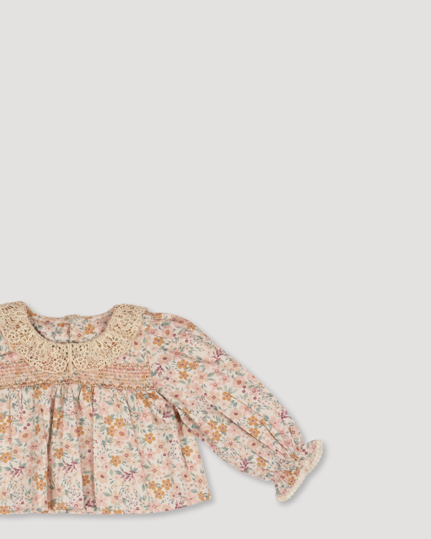 Early Sunday, Essie & Pippy Baby Set in Floral print, made from Printed 60s Cotton Satin fabric, featuring smocked sleeves with laced neckline & matching bloomers, shown in a closeup flat-lay view