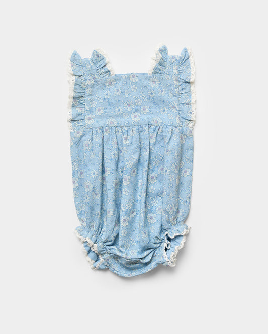 Early Sunday, Eva Baby Romper in Tonal Floral Blue color, made from 100% Cotton Swiss Dobby Tiny Dots fabric, featuring a sleeveless design with lace border, shown in a front flat-lay view