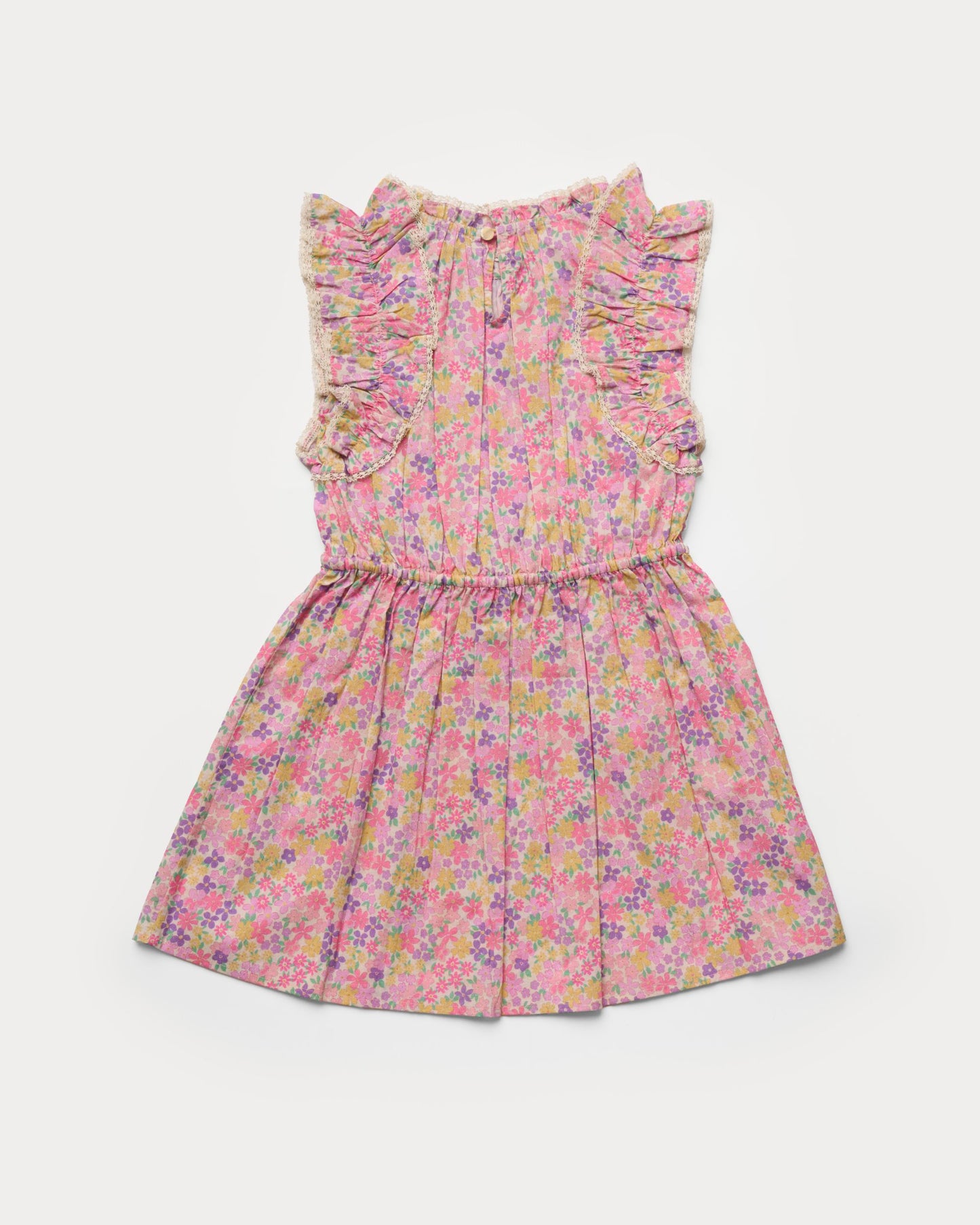 Early Sunday, Florence Dress in Emma Floral Purple color, made from printed cotton cambric fabric, featuring Ruffle detailing on the yoke and sleeves, lace accents, gathered waist with tassel tie, shown in a back flat-lay view