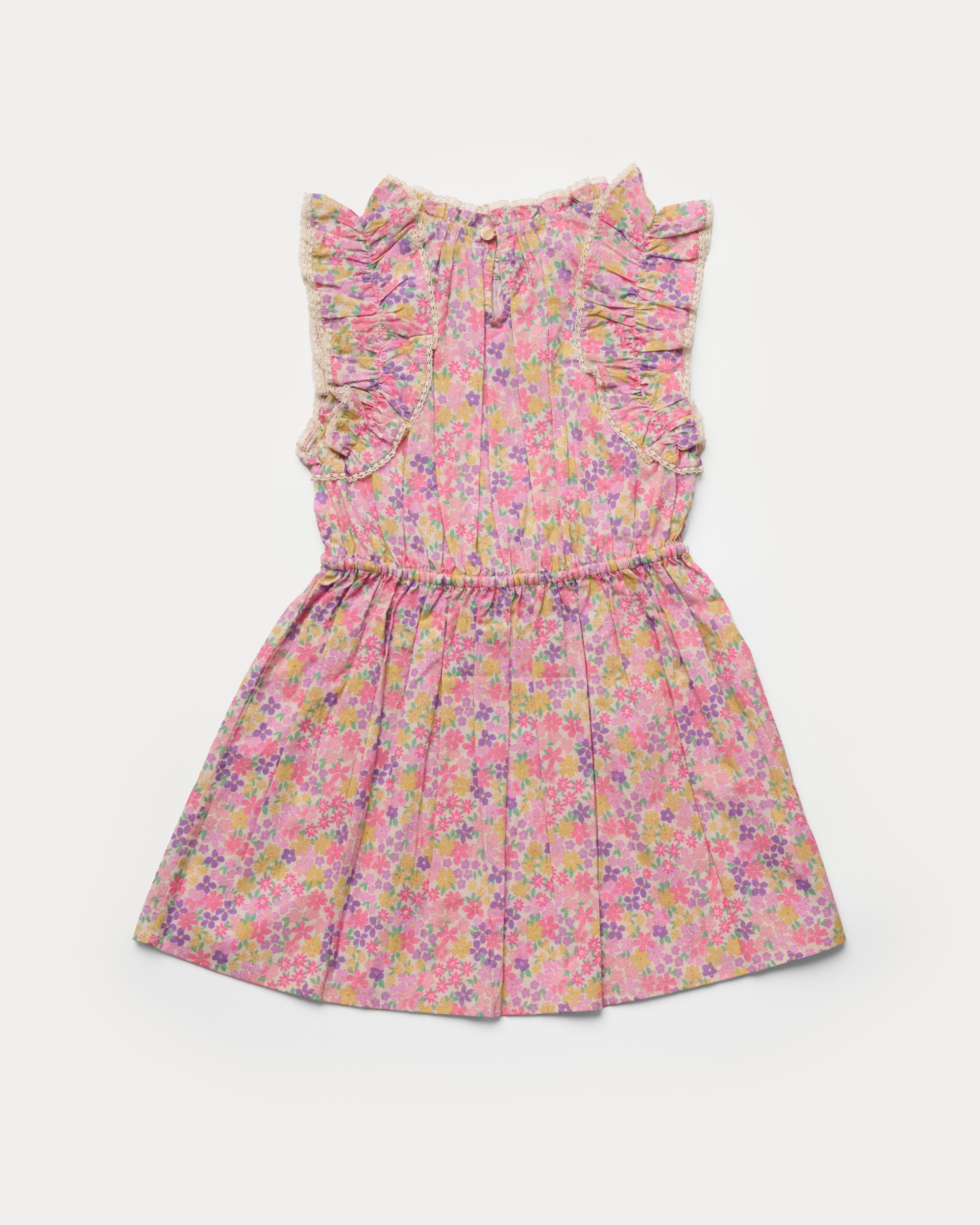 Early Sunday, Florence Dress in Emma Floral Purple color, made from printed cotton cambric fabric, featuring Ruffle detailing on the yoke and sleeves, lace accents, gathered waist with tassel tie, shown in a back flat-lay view