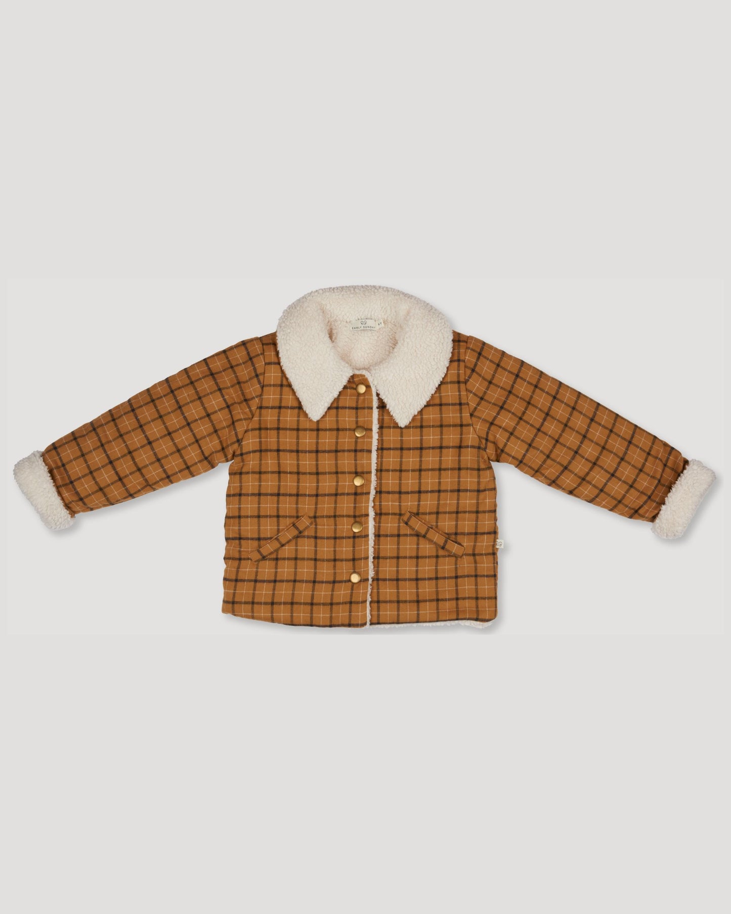 Early Sunday, Franka Jacket in Almond Checks, made from Cotton Yarn Dyed Brushed Checks fabric, featuring Cozy, softly structured jacket with a plush sherpa lining and gentle detailing for warmth without bulk, shown in a front flat-lay view