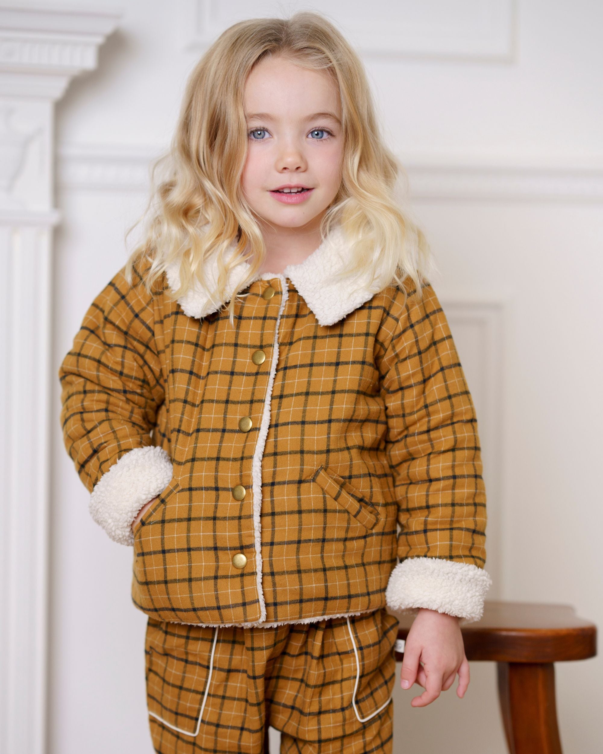 Early Sunday, Franka Jacket in Almond Checks, made from Cotton Yarn Dyed Brushed Checks fabric, featuring Cozy, softly structured jacket with a plush sherpa lining and gentle detailing for warmth without bulk, shown in a front view of model wearing it