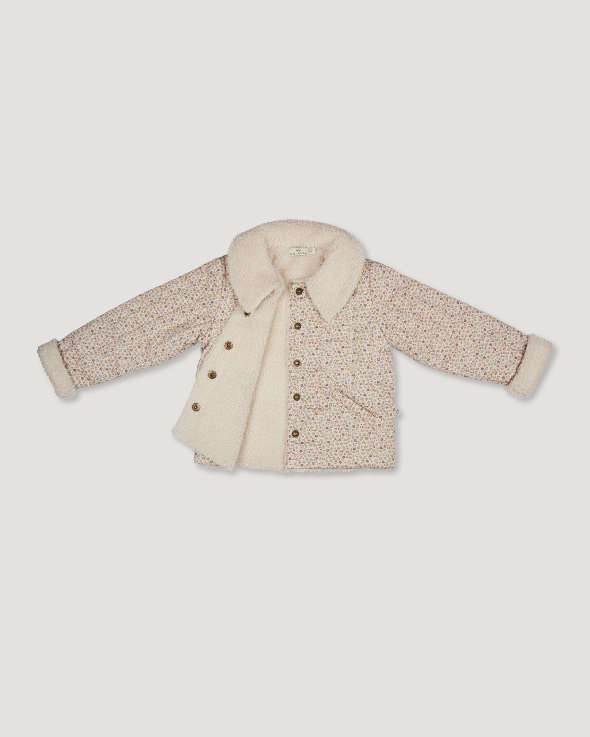 Early Sunday, Franka Jacket in Miny Flowers print, made from Printed 30s Cotton Twill fabric, featuring Cozy, softly structured jacket with a plush sherpa lining and gentle detailing for warmth without bulk, shown in a closeup flat-lay view