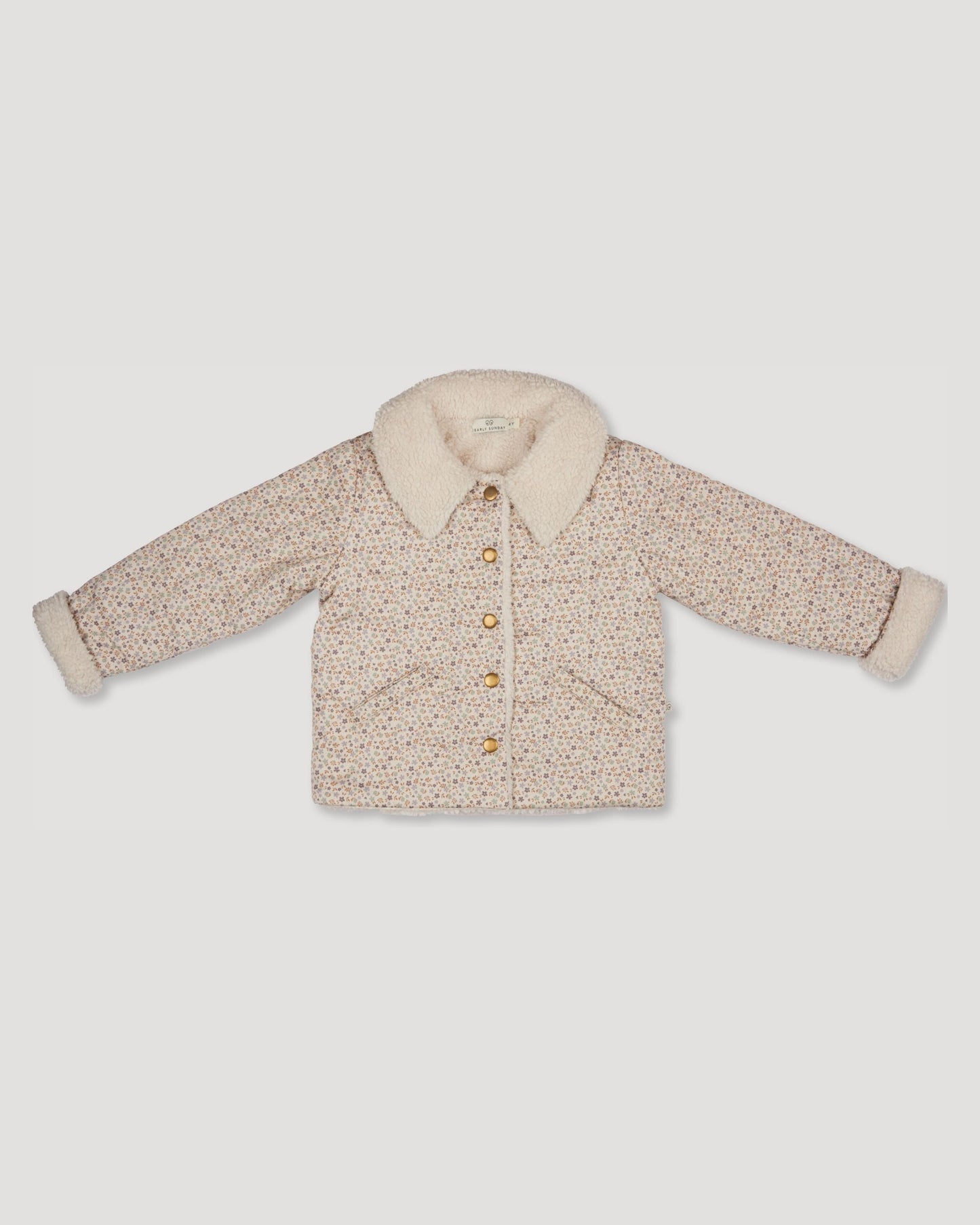Early Sunday, Franka Jacket in Miny Flowers print, made from Printed 30s Cotton Twill fabric, featuring Cozy, softly structured jacket with a plush sherpa lining and gentle detailing for warmth without bulk, shown in a front flat-lay view