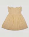 Early Sunday, Georgia Dress in Vanilla color, made from Cotton Dobby Swiss Dots fabric, featuring Flutter sleeves, pintuck detailing, and a flowy, gathered silhouette, shown in a back flat-lay view