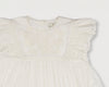 Early Sunday, Georgia Dress in Ivory print, made from Cotton Tiny Swiss Dots fabric, featuring Flutter sleeves, pintuck detailing, and a flowy, gathered silhouette, shown in a closeup flat-lay view