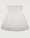 Early Sunday, Georgia Dress in Ivory print, made from Cotton Tiny Swiss Dots fabric, featuring Flutter sleeves, pintuck detailing, and a flowy, gathered silhouette, shown in a front flat-lay view