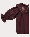 Early Sunday, Gladys Baby Bubble Romper in Plum, made from Cotton Double Gauze fabric, featuring a floral embroidered collar with beautiful lace yoke, shown in a closeup flat-lay view