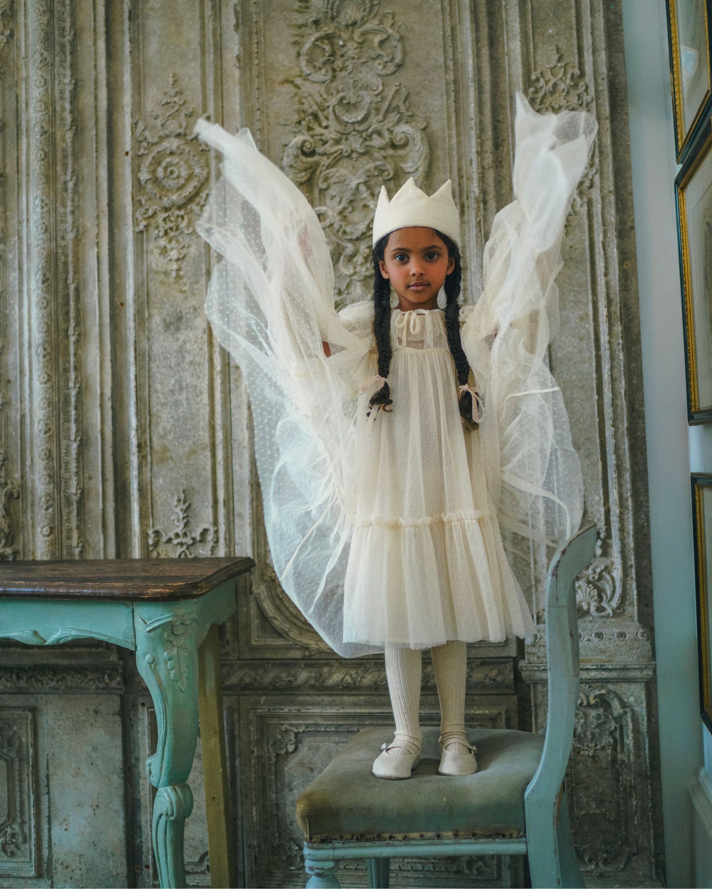 Early Sunday, Grace Cape in Hazelnut Cream, made from Dyed Nylon Mesh Dobby fabric, featuring Tiered ruffles create volume and whimsical movement, shown in a model in motion