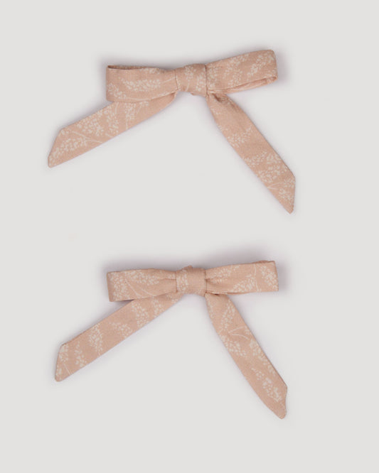 Early Sunday, Grace Clip in Feather print, made from Printed 60s Cotton Cambric fabric, featuring a set of two bow clips with a secure fit, shown in a front flat-lay view