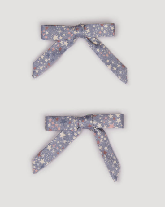 Early Sunday, Grace Clip in Celestial print, made from Printed 60s Cotton Satin fabric, featuring a set of two bow clips with a secure fit, shown in a front flat-lay view