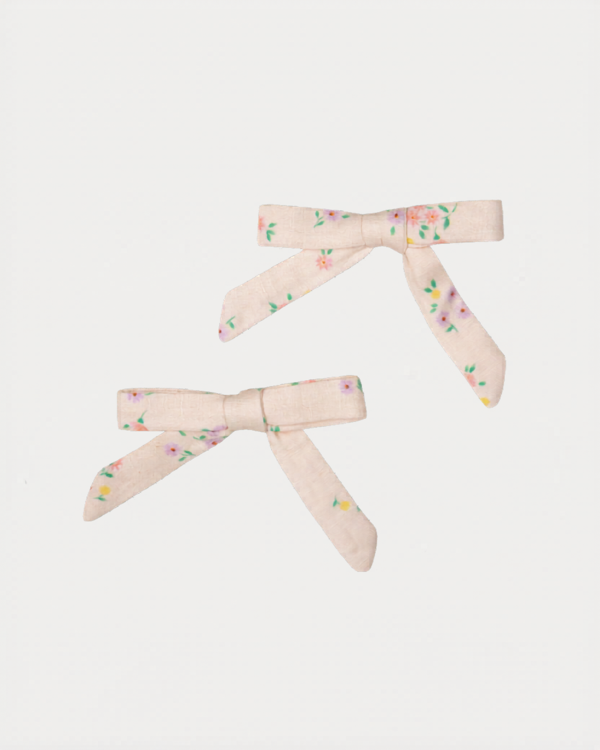 Early Sunday, Grace Clip in Painted Bouquet print, made from Printed 70% Cotton, 30% Linen fabric, featuring a set of two bow clips with a secure fit, shown in a front flat-lay view