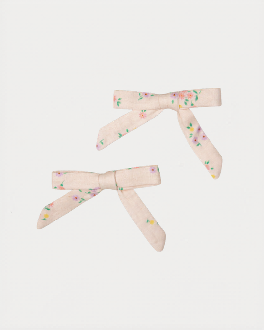 Early Sunday, Grace Clip in Painted Bouquet print, made from Printed 70% Cotton, 30% Linen fabric, featuring a set of two bow clips with a secure fit, shown in a front flat-lay view