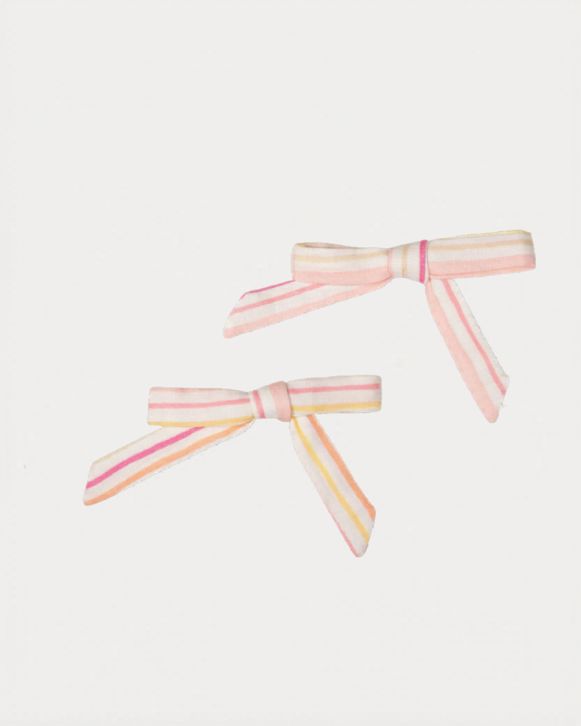 Early Sunday, Grace Clip in Pink Stripes print, made from Printed 70% Cotton, 30% Linen fabric, featuring a set of two bow clips with a secure fit, shown in a front flat-lay view
