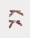 Early Sunday, Grace Clip in Garden Flowers Plum, made from Printed Cotton Satin fabric, featuring a set of two bow clips with a secure fit, shown in a back flat-lay view