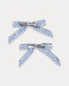 Early Sunday, Grace Clip in Tonal Floral Blue color, made from Printed Cotton Tiny Swiss Dobby fabric, featuring a set of two bow clips with a secure fit, shown in back flat-lay view