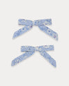 Early Sunday, Grace Clip in Tonal Floral Blue color, made from Printed Cotton Tiny Swiss Dobby fabric, featuring a set of two bow clips with a secure fit, shown in front flat-lay view