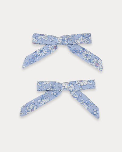 Early Sunday, Grace Clip in Tonal Floral Blue color, made from Printed Cotton Tiny Swiss Dobby fabric, featuring a set of two bow clips with a secure fit, shown in front flat-lay view