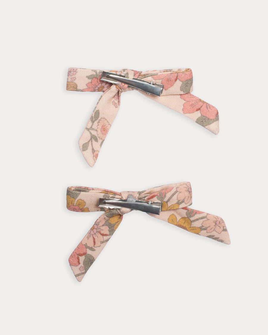Early Sunday, Grace Clip in Bloom Blush, made from Printed Viscose Twill fabric, featuring a set of two bow clips with a secure fit, shown in a back flat-lay view