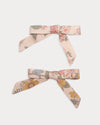 Early Sunday, Grace Clip in Bloom Blush, made from Printed Viscose Twill fabric, featuring a set of two bow clips with a secure fit, shown in a front flat-lay view