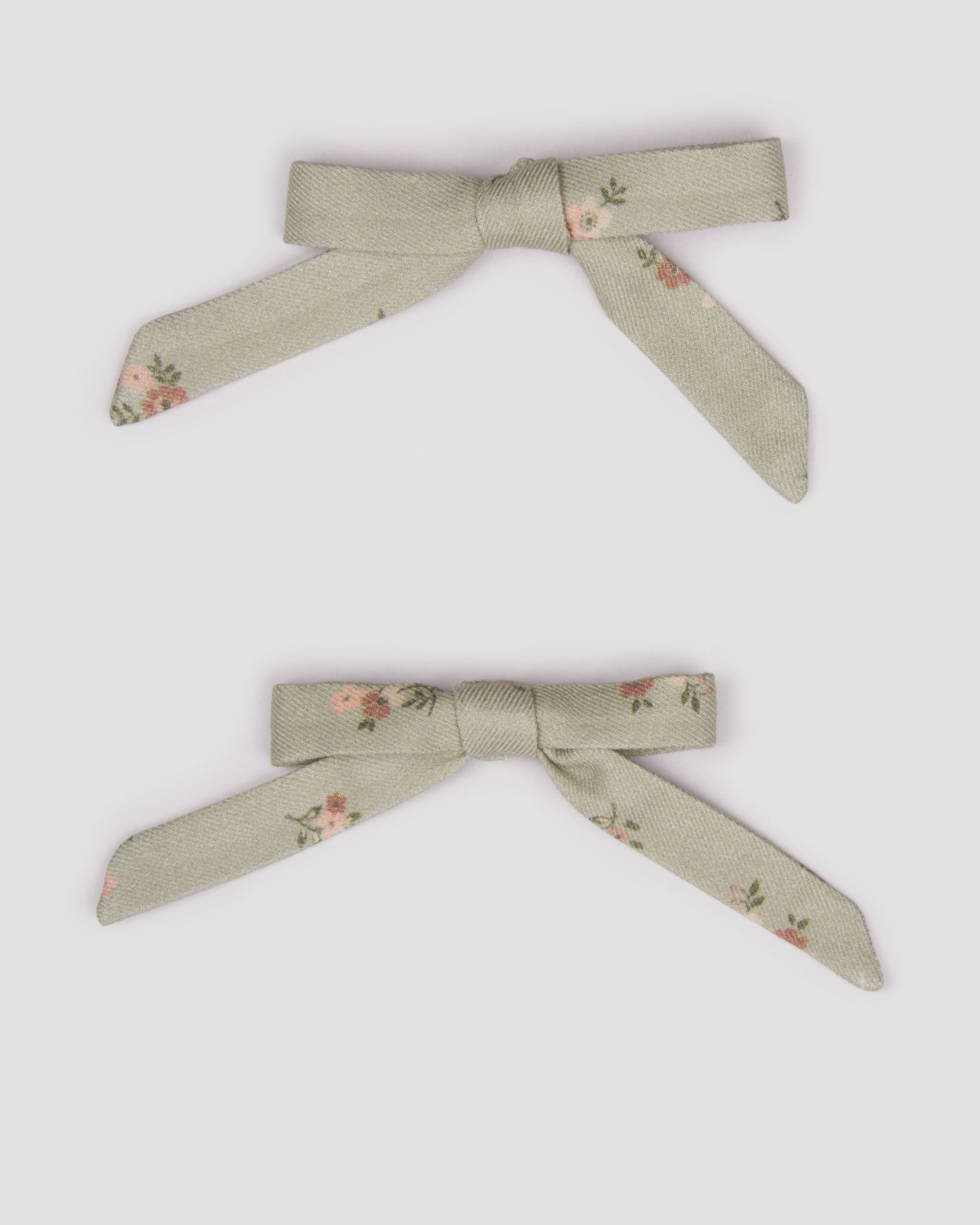 Early Sunday, Grace Clip in Ditsy Bouquet Jade print, made from Printed Viscose Twill fabric, featuring a set of two bow clips with a secure fit, shown in a front flat-lay view