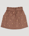 Early Sunday, Hilda Skirt in Bark, made from All-over embroidered 30s cotton brushed twill fabric, featuring A-line shape with a gathered elastic waistband for comfort, shown in a front flat-lay view
