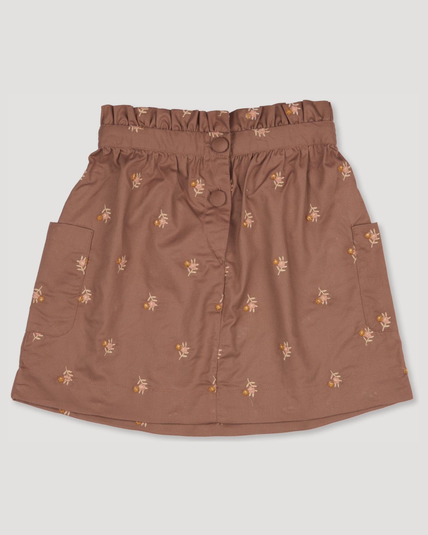 Early Sunday, Hilda Skirt in Bark, made from All-over embroidered 30s cotton brushed twill fabric, featuring A-line shape with a gathered elastic waistband for comfort, shown in a front flat-lay view