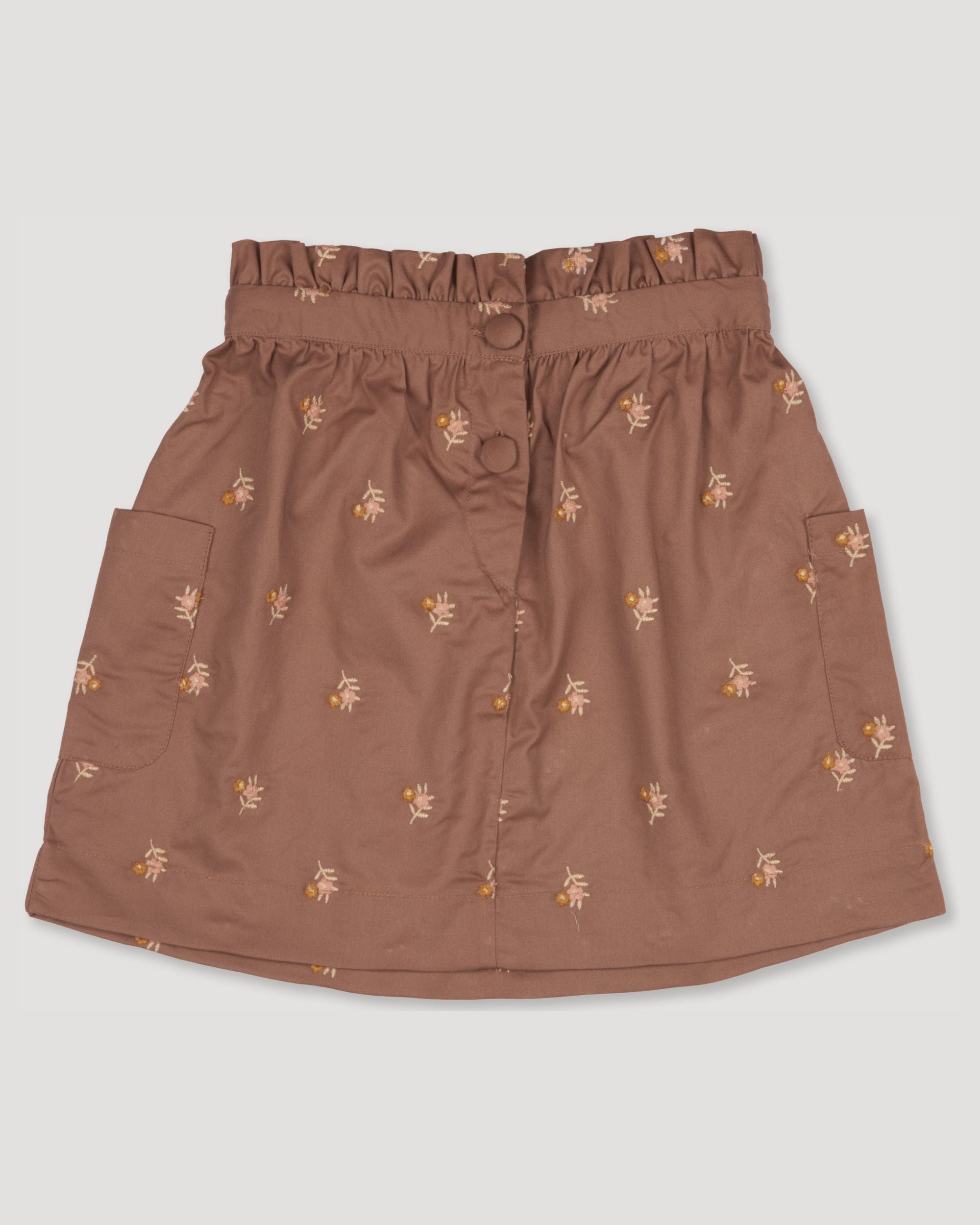 Early Sunday, Hilda Skirt in Bark, made from All-over embroidered 30s cotton brushed twill fabric, featuring A-line shape with a gathered elastic waistband for comfort, shown in a front flat-lay view