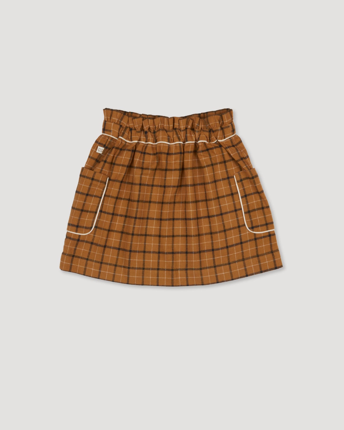 Early Sunday, Hilda Skirt in Almond Checks, made from Cotton Yarn Dyed Brushed Checks fabric, featuring A-line shape with a gathered elastic waistband for comfort, shown in a back flat-lay view