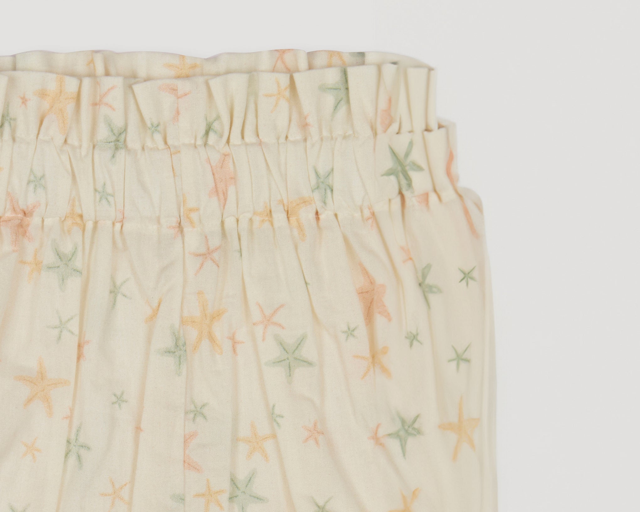 Early Sunday, Holly Baby Shorts in Star Fish print, made from Printed Cotton Cambric fabric, featuring wide brim for sun protection, designed to be lightweight and comfortable for all-day wear, shown in a closeup flat-lay view