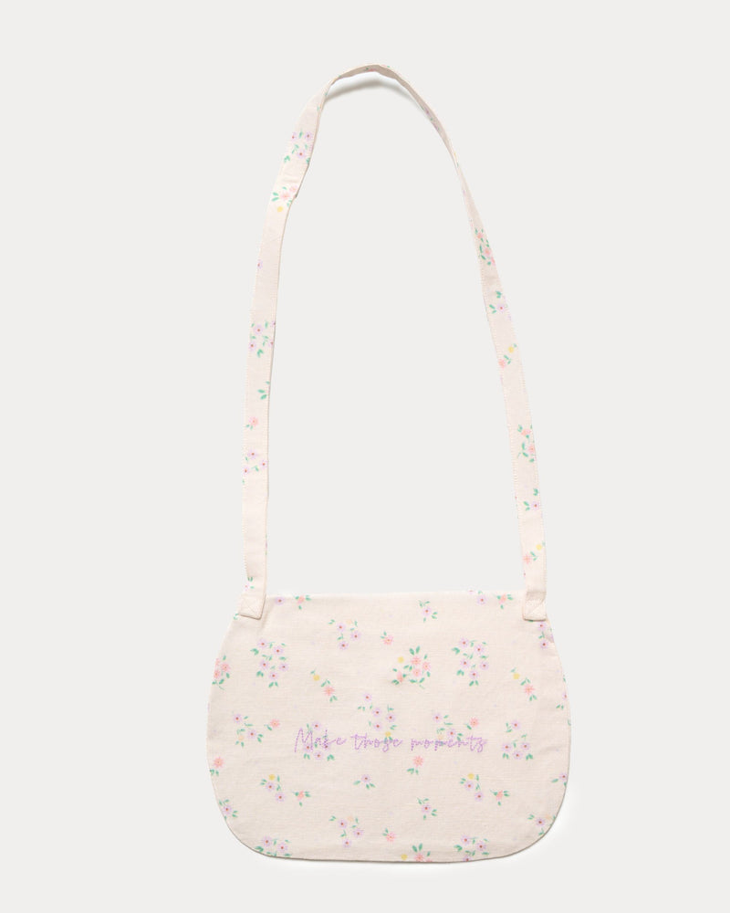 Early Sunday, Hudson Purse in Painted Bouquet print, made from 70% Cotton, 30% Linen fabric, featuring a gathered sling purse design with a flap closure, shown in a back flat-lay view