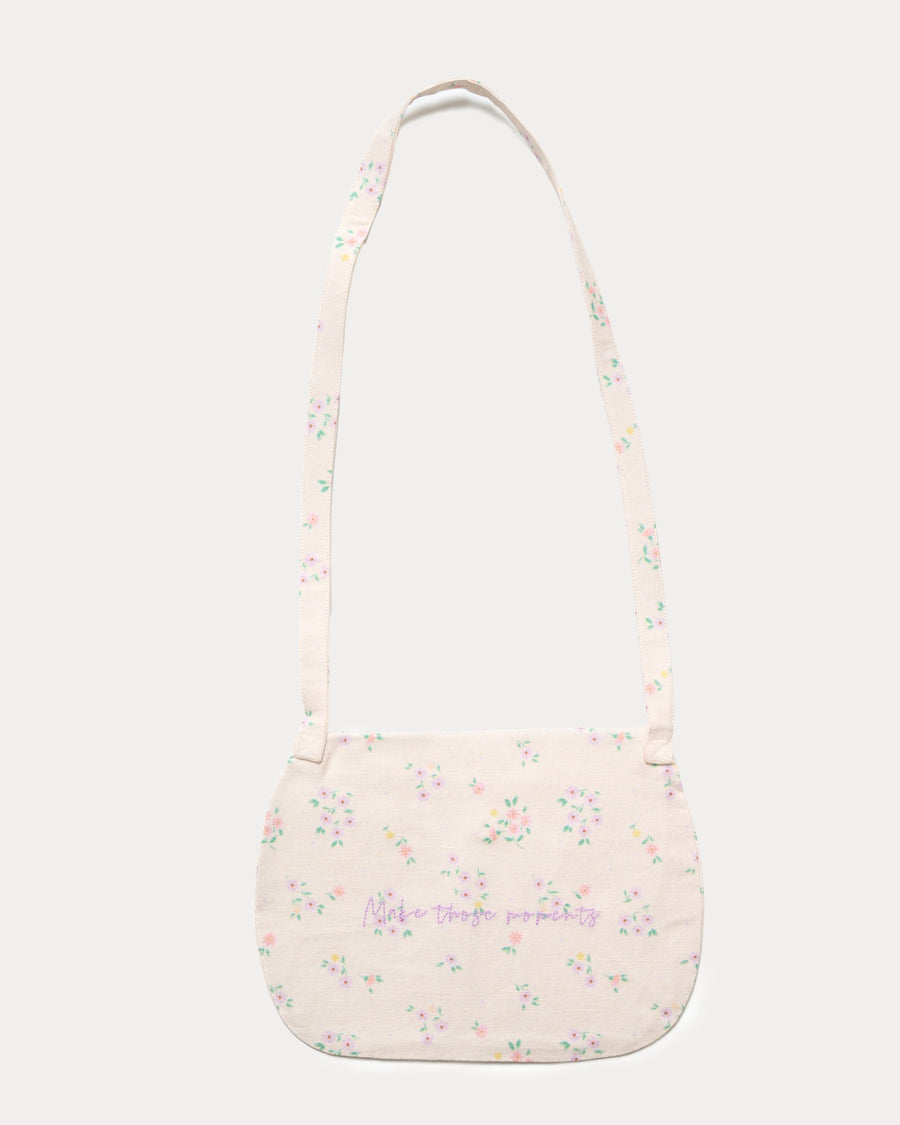 Early Sunday, Hudson Purse in Painted Bouquet print, made from 70% Cotton, 30% Linen fabric, featuring a gathered sling purse design with a flap closure, shown in a back flat-lay view