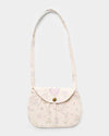 Early Sunday, Hudson Purse in Painted Bouquet print, made from 70% Cotton, 30% Linen fabric, featuring a gathered sling purse design with a flap closure, shown in a front flat-lay view