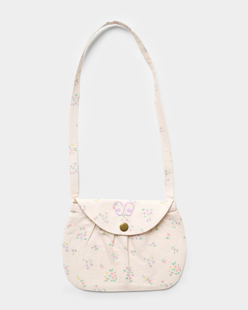Early Sunday, Hudson Purse in Painted Bouquet print, made from 70% Cotton, 30% Linen fabric, featuring a gathered sling purse design with a flap closure, shown in a front flat-lay view