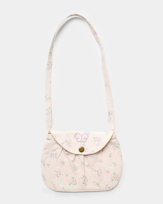Early Sunday, Hudson Purse in Painted Bouquet print, made from 70% Cotton, 30% Linen fabric, featuring a gathered sling purse design with a flap closure, shown in a front flat-lay view