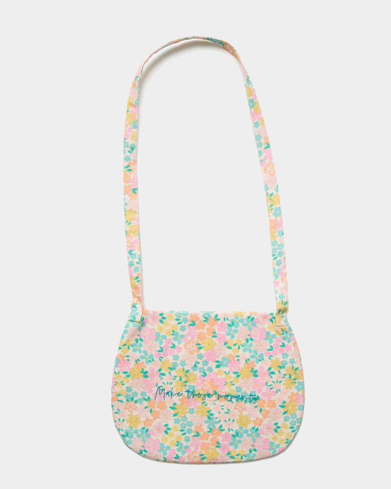 Early Sunday, Hudson Purse in Emma Floral Mint color, made from Organic Printed Cotton Cambric fabric, featuring a gathered sling purse design with a flap closure, shown in back flat-lay view