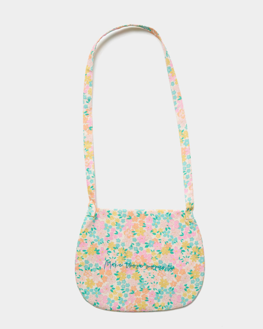Early Sunday, Hudson Purse in Emma Floral Mint color, made from Organic Printed Cotton Cambric fabric, featuring a gathered sling purse design with a flap closure, shown in back flat-lay view