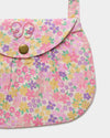 Early Sunday, Hudson Purse in Emma Floral Purple color, made from Organic Printed Cotton Cambric fabric, featuring a gathered sling purse design with a flap closure, shown in closeup flat-lay view