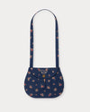 Early Sunday, Hudson Purse in Ditsy Bouquet Navy Blue, made from Printed Cotton Satin fabric, featuring a gathered sling purse design with a flap closure, shown in a front flat-lay view